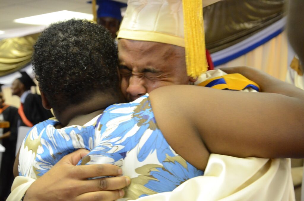 Graduates hugging